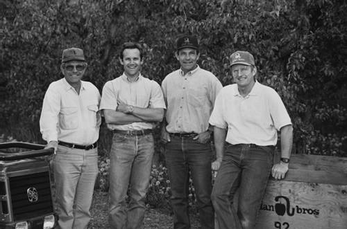 In the care of the third generation - Dave, Todd, George, Larry (left to right) – the company expanded even further to include shipping docks, multiple apple and cherry packing lines, quality control systems, new orchard plantings, and strengthened business relationships throughout the tree fruit industry. Larry oversaw machines, storage and refrigeration; Todd managed people and sales, George served as CEO, and Dave was the company’s horticulturist, overseeing the orchards.